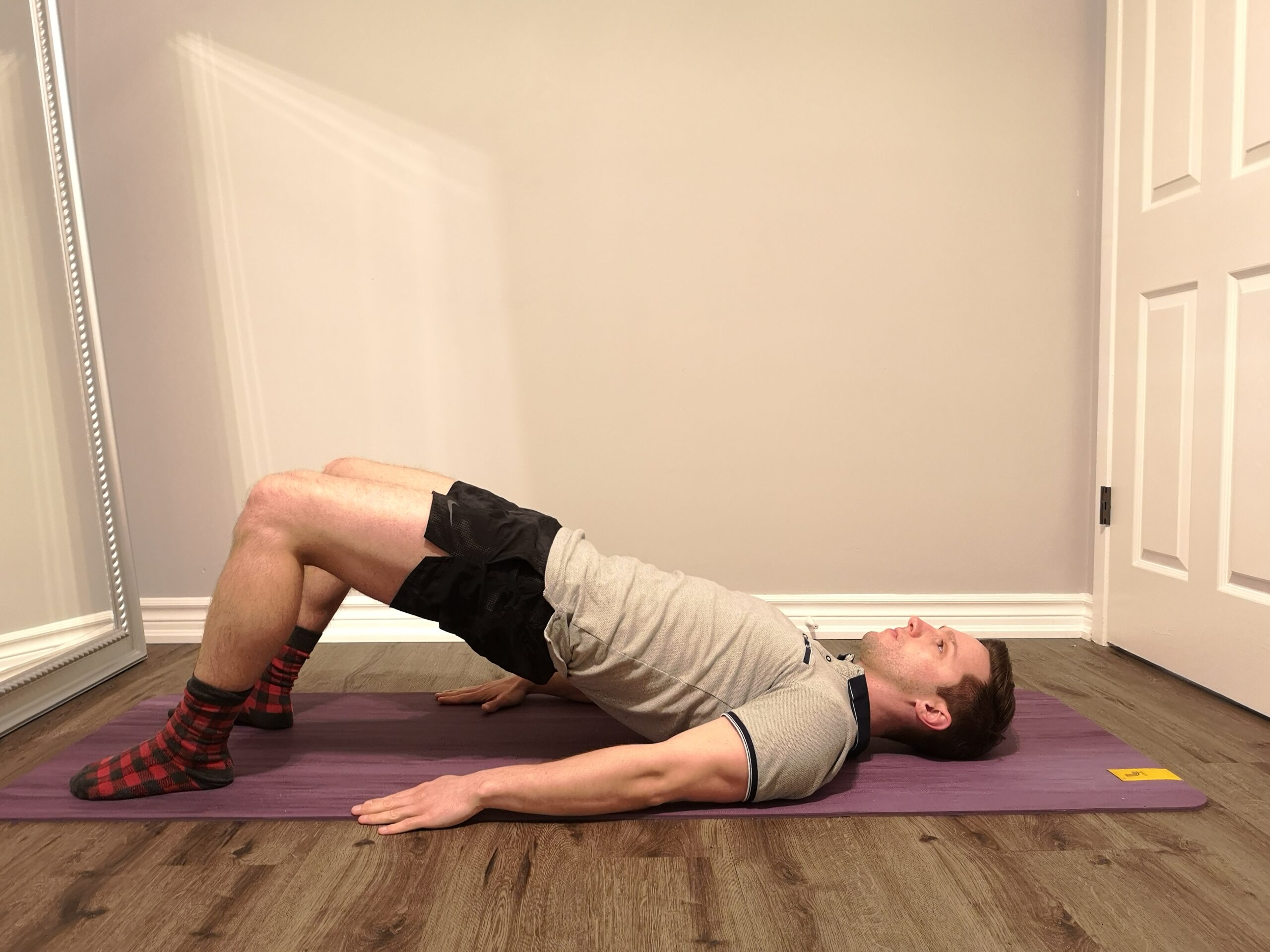 Glute Bridge demonstrated by Physiotherapist Ryan Marrin