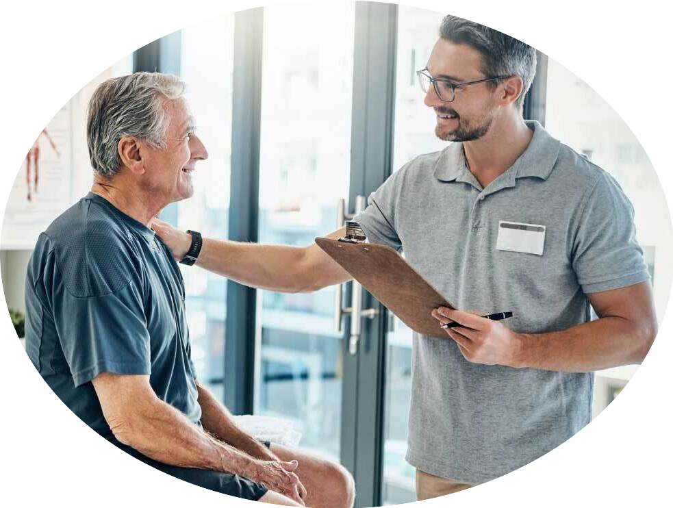 A male physiotherapist is consoling a male patient