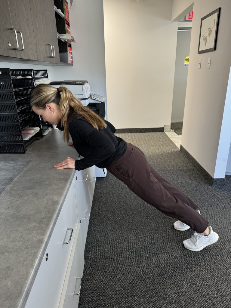 Desk Push Up demonstrated by Physiotherapist Anna Pelczar