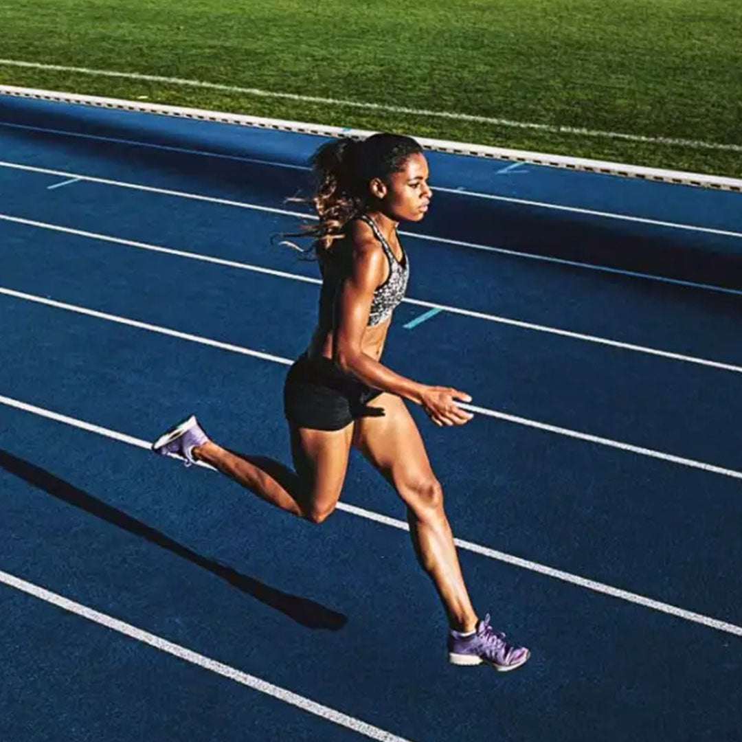 Athlete running a sprint on a track
