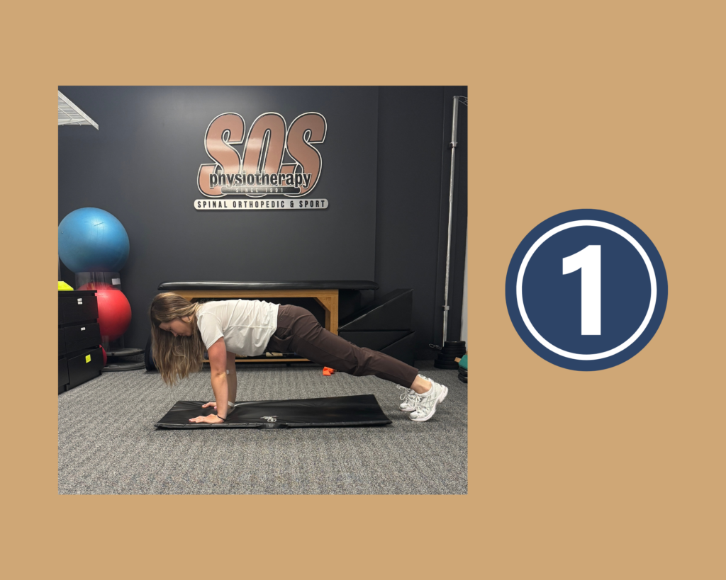 Step 1 of Downward Dog with Calf Extensions Stretch demonstrated by physiotherapist Anna Pelczar