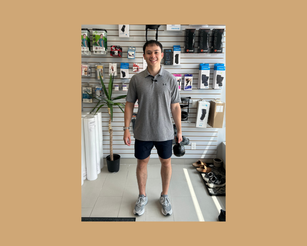 Suitcase Carry Exercise photo demonstration by Physiotherapist Adam Hanton-Fong